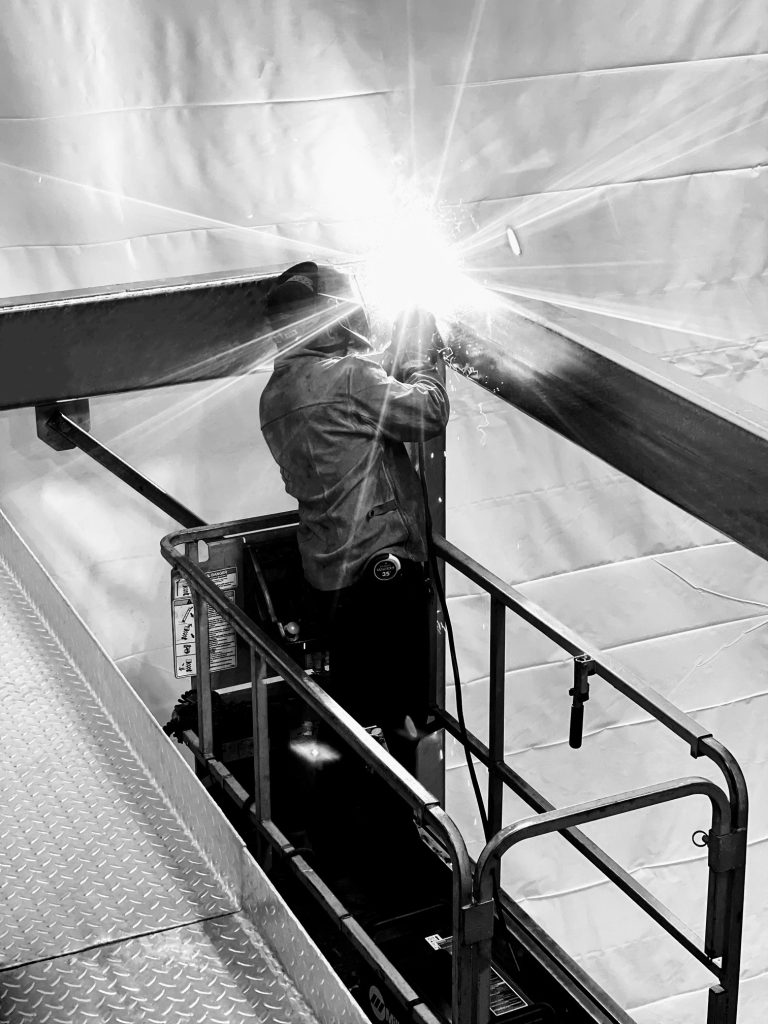 Industrial Welding For Construction Project Black and White Vertical