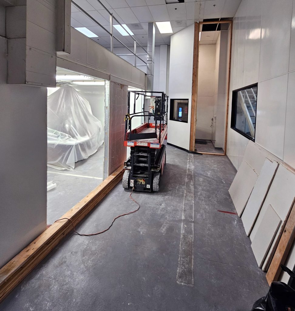 progress with new double doors, drywall, and FRP underneath mezzanine