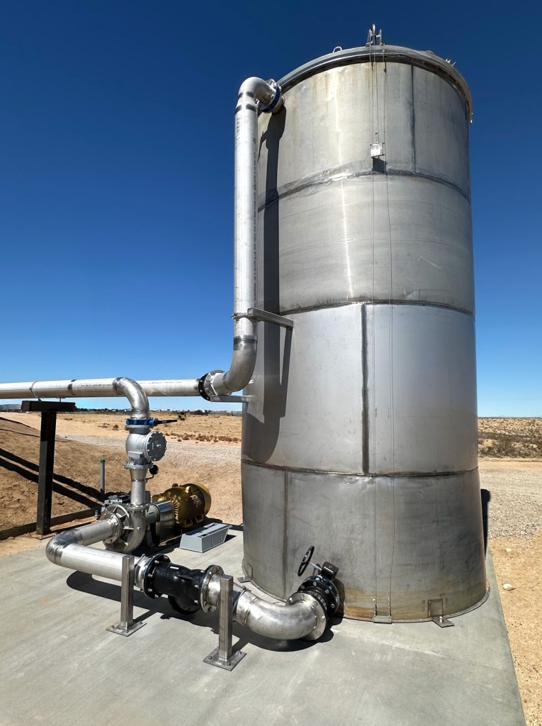 stainless steel custom pump and tank on concrete pad