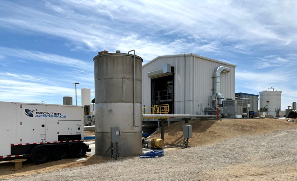 jobsite photo of pump tank pipe and testing station